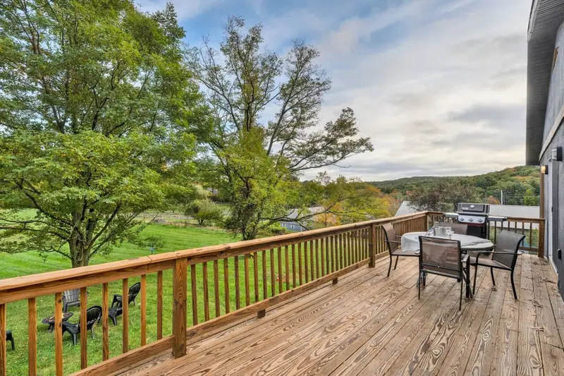 Deck with outdoor dining and a grill