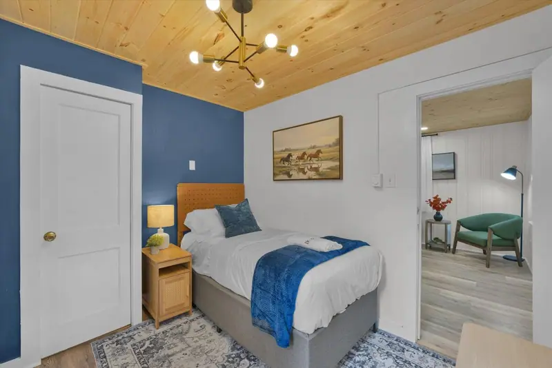 Soft linens, warm wood ceilings and calming blue tones create a restful place to recharge.