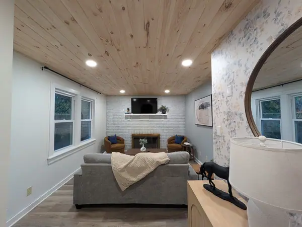 Long and light-filled, framed by a floral accent wall. Room to spread out after a day outdoors.