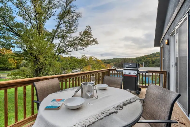 Outdoor dining with hillside views