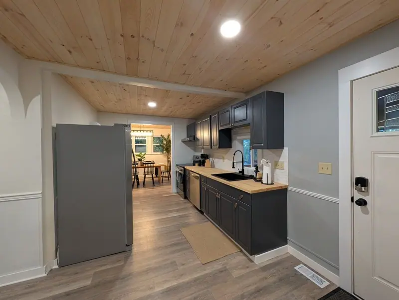Galley-style kitchen that opens straight into the dining room, so the cook never misses the conversation.